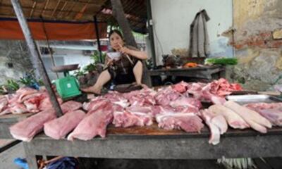 Quầy bán thịt heo. AFP