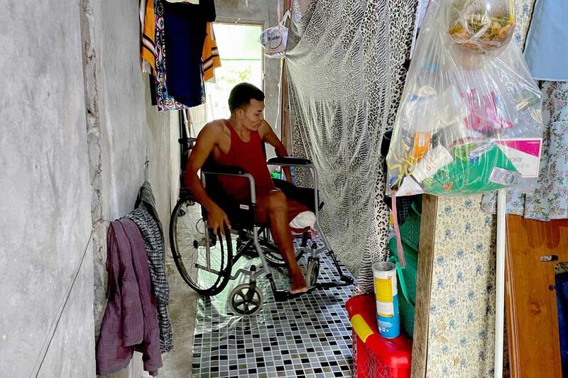 Maneuvering in his three-room home is one of the many things Ko Phyo has had to learn since losing his leg. (REUTERS)