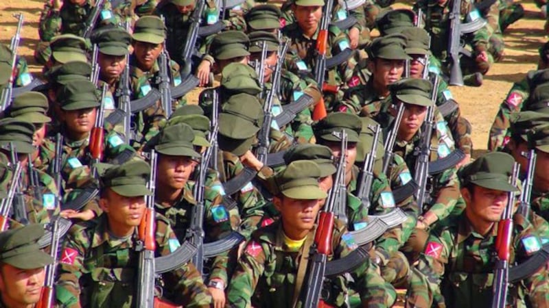 Ta'ang National Liberation Army soldiers march during a military parade commemorating the ethnic army's Revolution Day in Kyaukme township, Myanmar's northern Shan state, Jan. 14, 2016. 