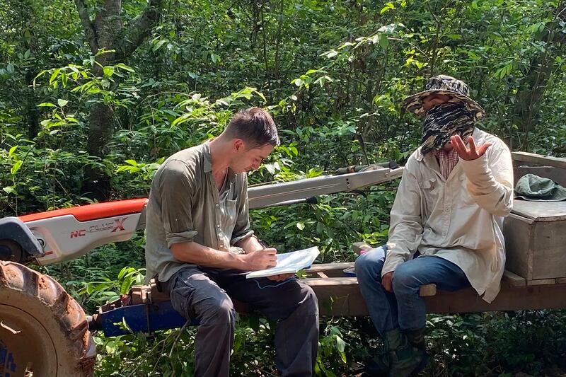 Gerald Flynn, left, a 2022 Fellow in the Pulitzer Center's Rainforest Investigations Network, has lived and reported in Cambodia since 2019.