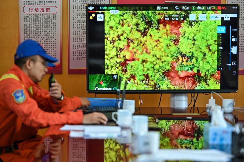 A member of the Yunnan Forest Brigade monitoring a herd of migrating elephants from the command center in Daqiao in southwest China's Yunnan province, July 23, 2021. Credit: AFP