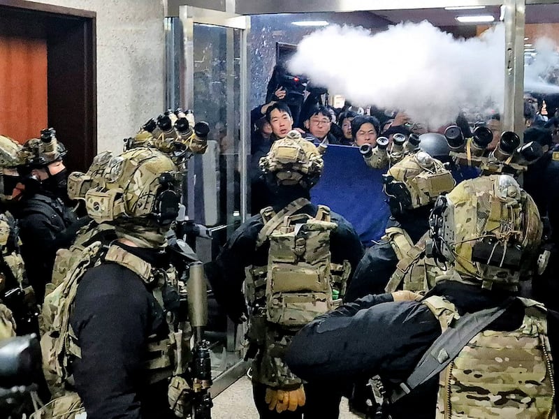 Soldiers try to enter the main hall of the National Assembly in Seoul on Dec. 3, 2024, after South Korea President Yoon Suk Yeol declared martial law.