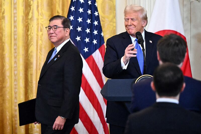 President Donald Trump and Japanese Prime Minister Shigeru Ishiba arrive for a joint press conference in the East Room of the White House in Washington,  Feb. 7, 2025.