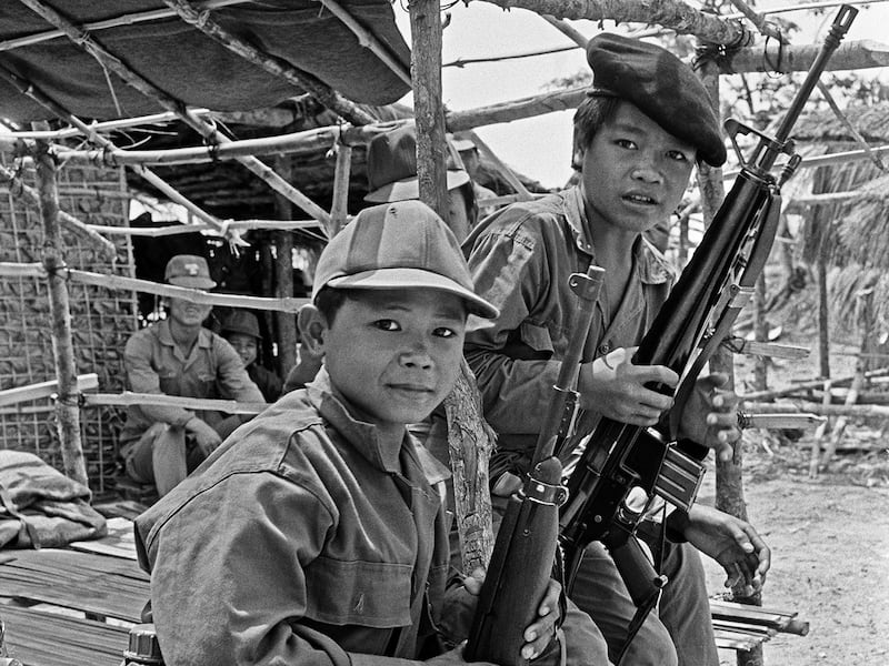 Young military volunteers rest at the Kalong outpost in central Laos, 20 miles from the Ho Chi Minh Trail, March 19, 1970.