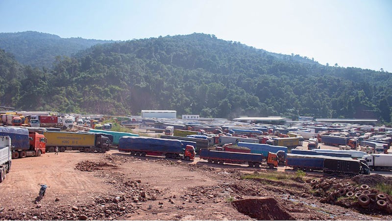 A lot near the Boten border gate in Laos' Luang Namtha province where hundreds of trucks are parked while waiting to enter China, Dec. 4, 2021. RFA