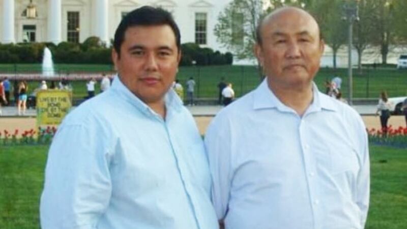 Iskender Memet (L) and his father, Memet Abdulla (R), at the White House in Washington, in an undated photo. Iskender Memet