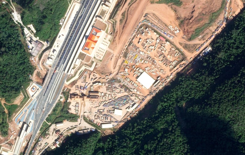 Trucks are seen backed up at the border checkpoint between Laos and China at Boten, Laos, in this satellite image from Jan. 3, 2021. (Planet Labs with analysis by RFA)