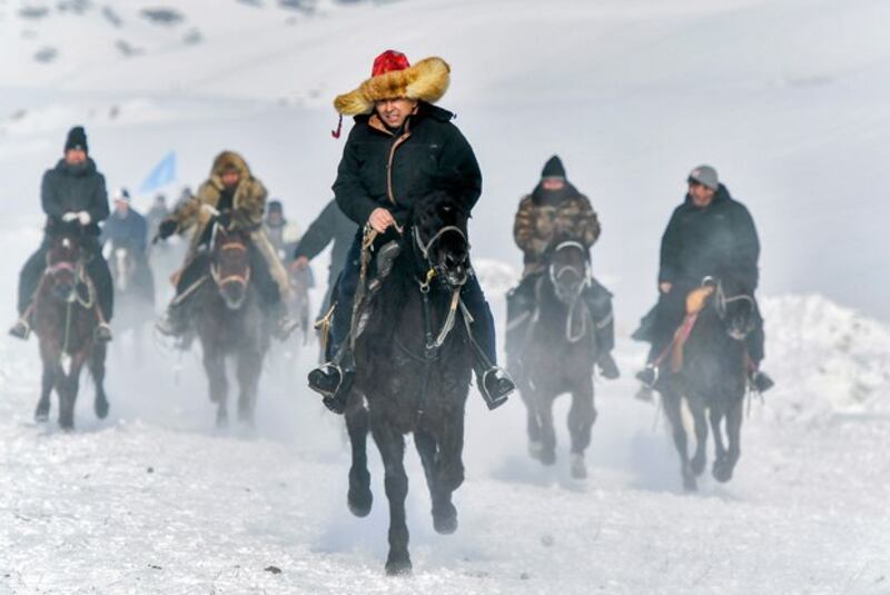 Herdsmen attend a horse race to welcome the upcoming Lunar New Year in Urumqi, capital of northwest China's Xinjiang region, Jan. 27, 2024. (Liu Xin/China News Service/VCG via Getty Images)