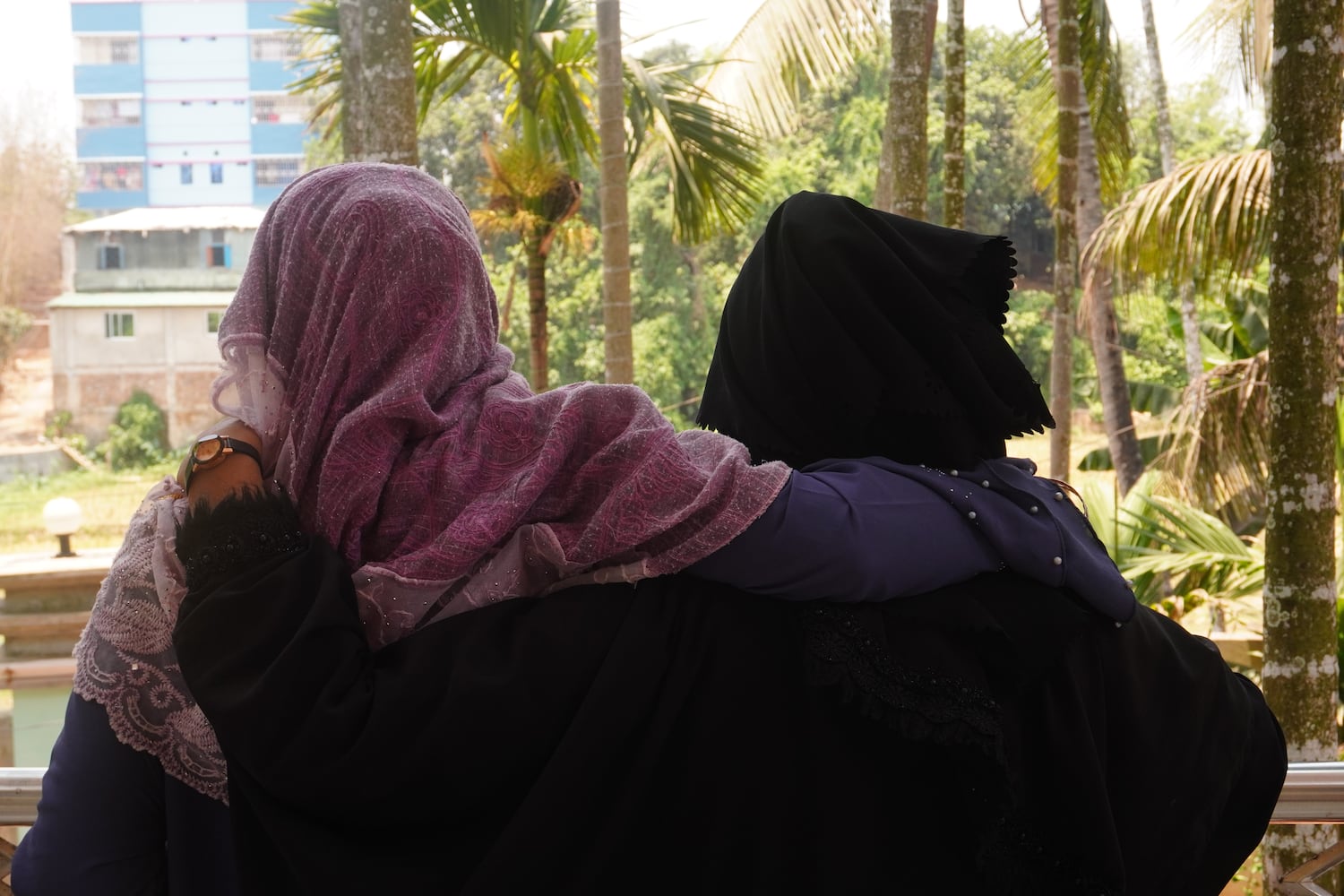 Shanti Mohila members stand in an embrace in a gesture of support and solidarity, in Cox’s Bazar, Bangladesh, in 2022.