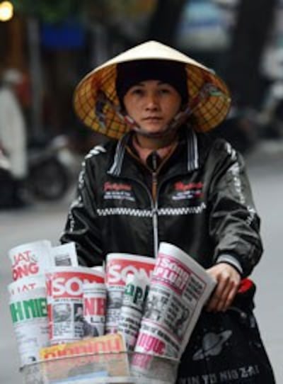 Bán báo dạo ở Hà Nội. AFP photo