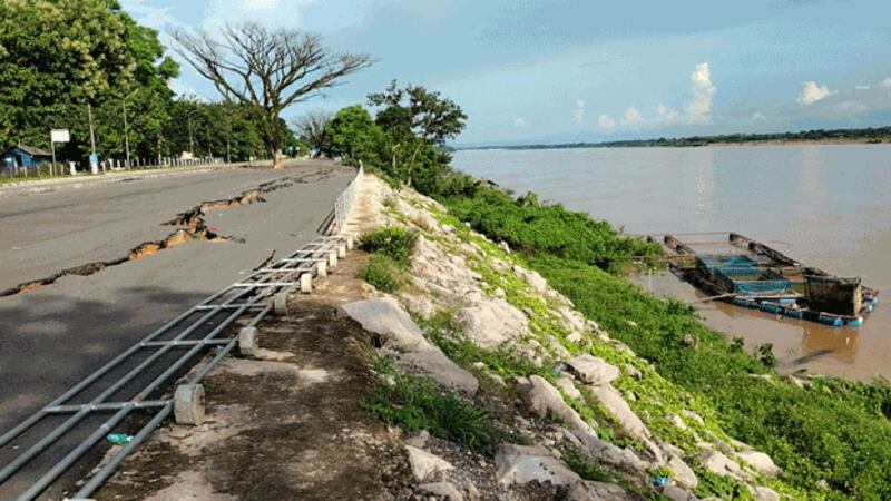 Land subsidence from erosion has cracked this road near the bank of the Mekong River in Paksan, Bolikhamxay province, central Laos, July 16, 2022. Credit: RFA