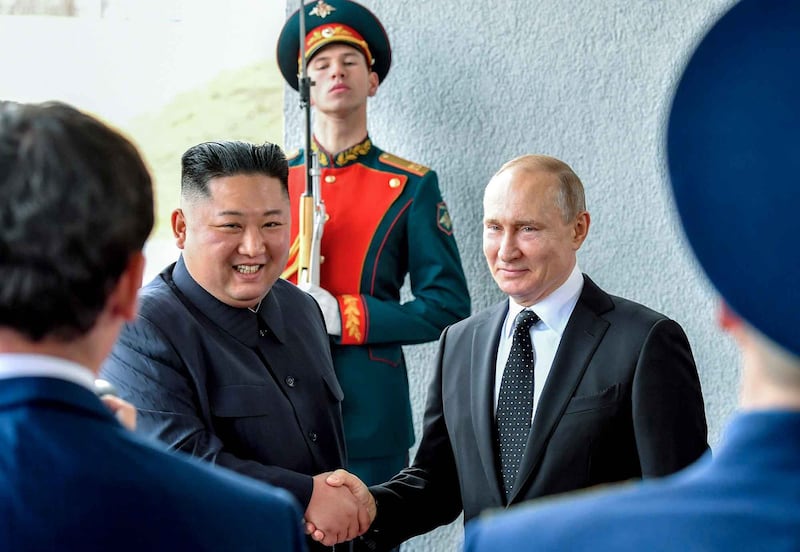 Russian President Vladimir Putin and North Korean leader Kim Jong Un shake hands during their meeting in Vladivostok, Russia, April 25, 2019. Credit: Yuri Kadobnov/Pool via AP