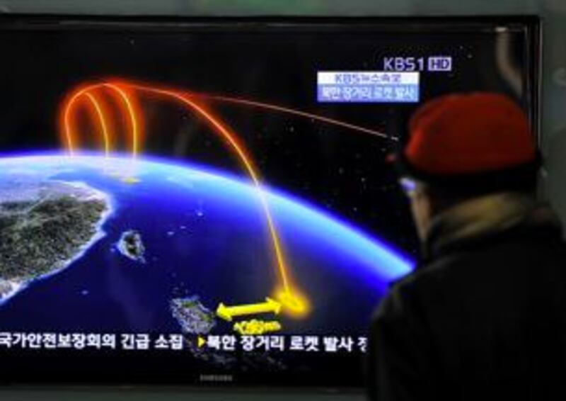 A man watches a South Korean TV broadcast on the rocket launch at a railway station in Seoul, Dec. 12, 2012. Credit: AFP.