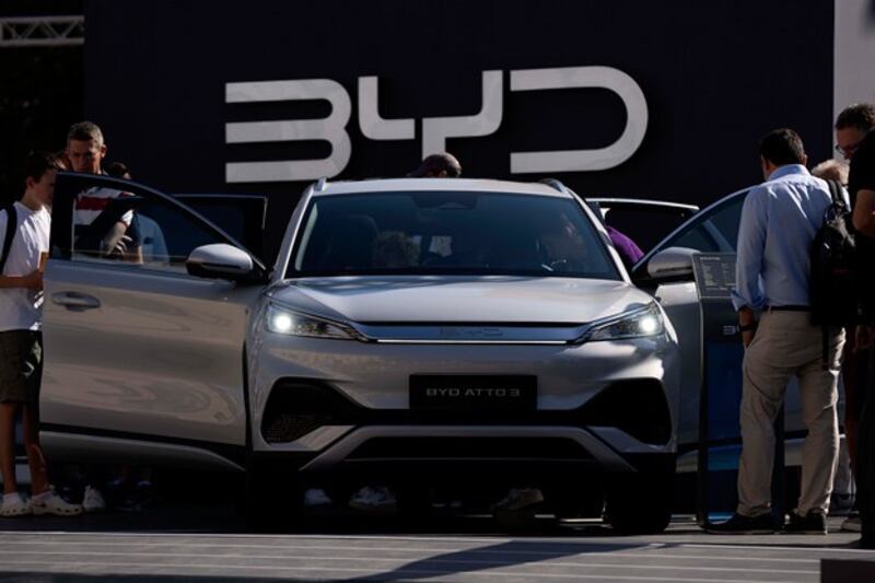 Visitors look at Chinese automaker BYD's ATTO 3 at the Munich Auto Show, also known as the Internationale Automobil-Ausstellung, in Munich, Germany, Sept. 8, 2023. (Matthias Schrader/AP)