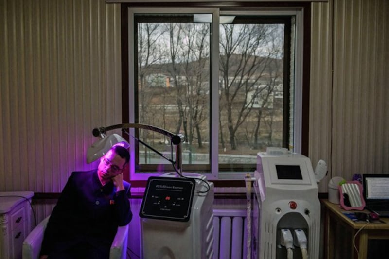 A man undergoes a hair-restoration procedure at the Sinuiju Cosmetics Factory in the North Korean border city of Sinuiju in 2018. Credit: Ed Jones/AFP