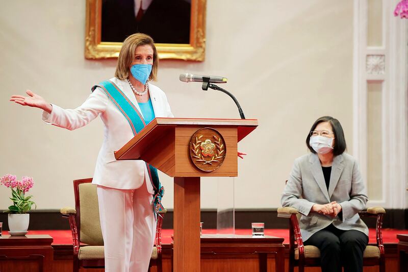 U.S. House Speaker Nancy Pelosi speaks during a meeting with Taiwan President Tsai Ing-wen, right, in Taipei, on Aug. 3, 2022. (Taiwan Presidential Office via AP)