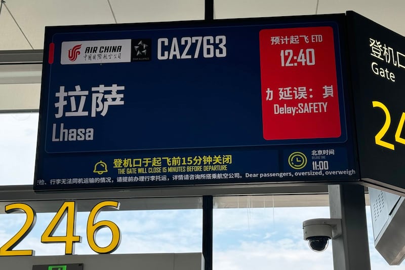 A sign showing flight details at Lhasa Gonggar International Airport in Tibet’s capital Lhasa is seen in 2024.