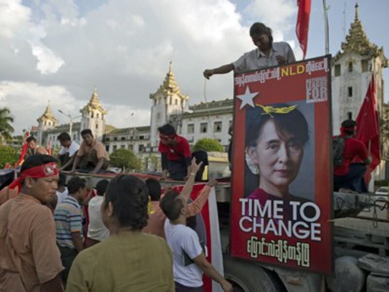 Supporters of Myanmar's National League for Democracy party set up a stage outside the main train station before a rally in Yangon, Nov. 5, 2015.