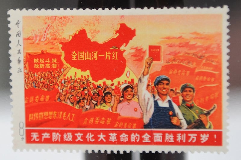 A 1968 “Whole Country is Red” stamp is displayed before being auctioned in Hong Kong on Jan. 27, 2010. (Mike Clarke/AFP)