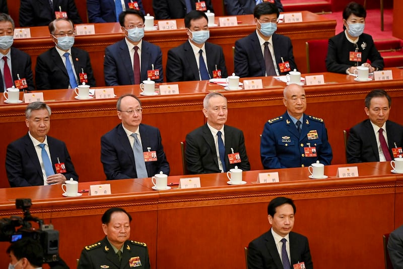 Politburo Standing Committee member Li Xi, Beijing Communist Party Secretary Yin Li, China's Vice Premier Liu He, Vice Chairman of China's Central Military Commission Xu Qiliang and CPC Central Committee Political Bureau member Li Ganjie attend the fourth plenary session of the National People's Congress (NPC) at the Great Hall of the People in Beijing, March 11, 2023. (Greg Baker/Pool via Reuters)