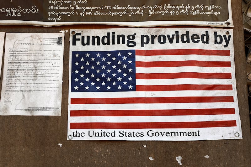 A poster is displayed inside a food distribution building at the Umpiem Mai Refugee Camp on the Thai-Myanmar border at Phop Phra district, Tak Province, Feb. 7, 2025.