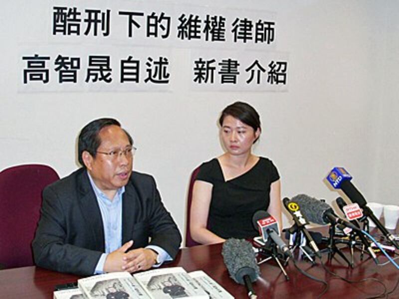 Albert Ho (L), chairman of the China Human Rights Lawyer Concern Group, and Grace Geng (R), daughter of dissident lawyer Gao Zhisheng, address the media at the book launch in Hong Kong, June 14, 2016.