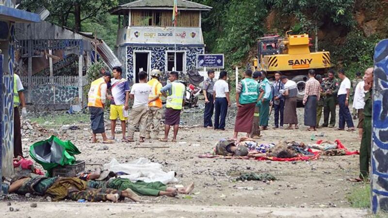 Bodies are seen on the ground at the Gote Twin Bridge police outpost in Nawngkhio township, Myanmar's northern Shan state, following an attack by ethnic rebel groups, Aug 15, 2019. 