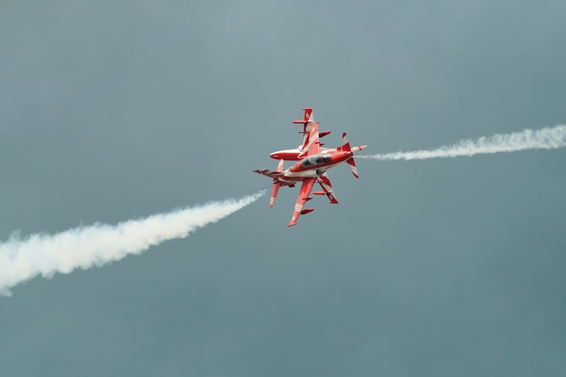 India’s Air Force Surya Kiran Aerobatic Team fly Hawk Mk-132 jets as they perform over Don Mueang air base in Bangkok, March 7, 2025.