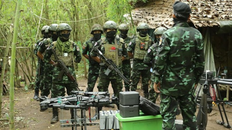 Members of the anti-junta drone militia group Federal Wings listen to instructions from their commander in an undisclosed location in Myanmar, Sept. 4, 2023. Credit: Federal Wings