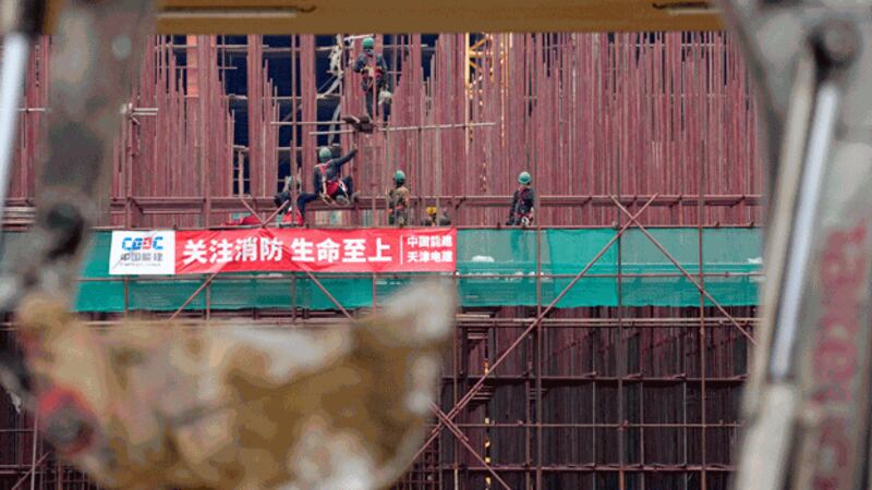 vietnam-workers-steel-bars-tire-plant-serbia-nov18-2021.jpg