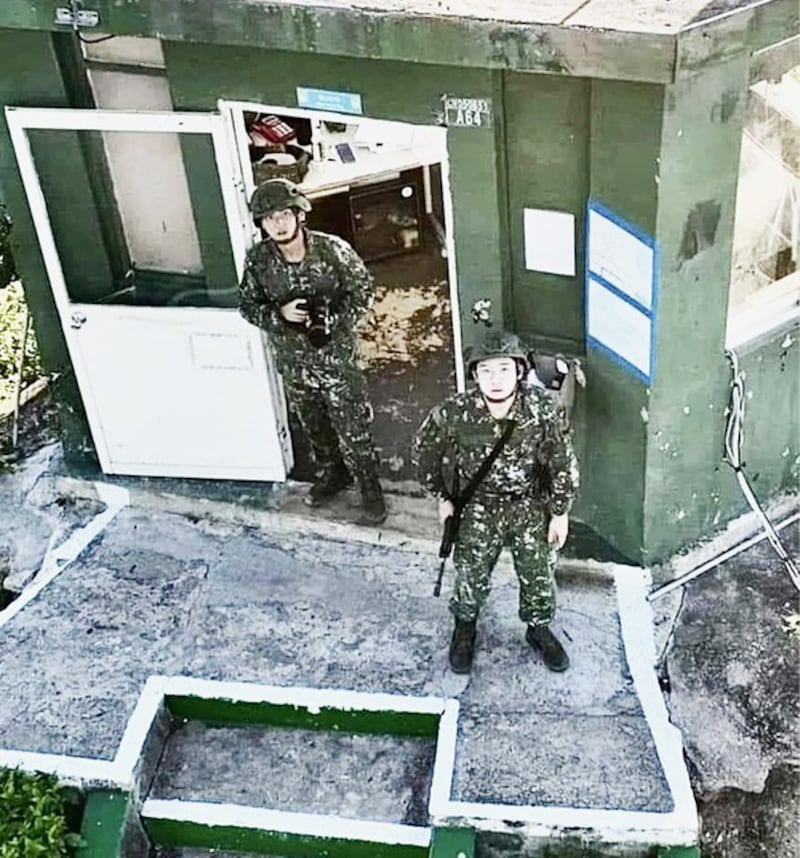 Taiwanese soldiers looking up at a Chinese drone from their watch station on Erdan islet, Kinmen County, on Aug. 16, 2022. Screenshot from video posted on Weibo