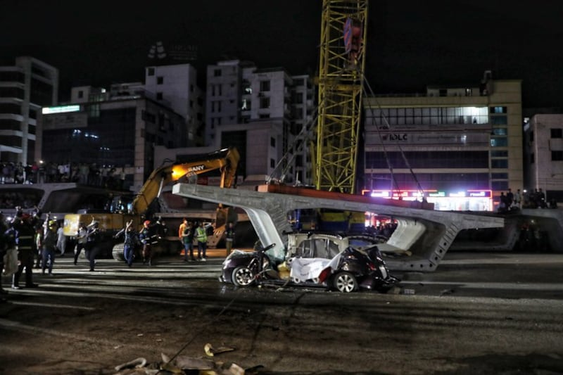 Five members of a family were crushed to death when a girder fell on their car at a construction site along the Dhaka-Mymensingh national highway in Uttara, a suburb of Dhaka, Aug. 15, 2022. Credit: BenarNews