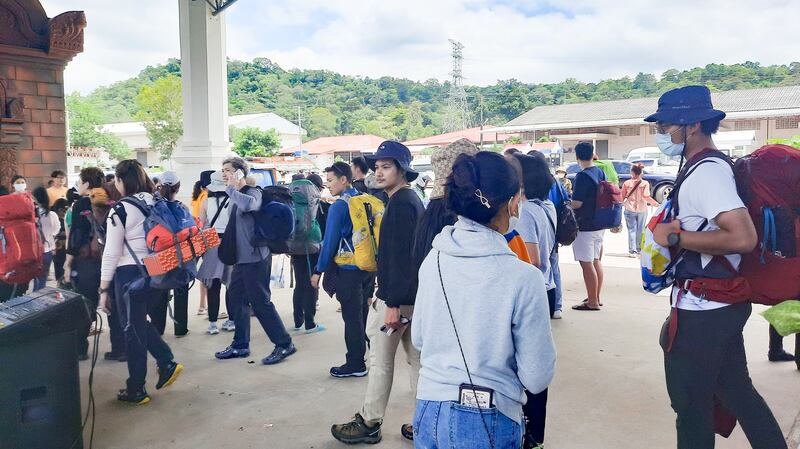 Lao workers travel to work in Thailand, July 28, 2023. Credit: RFA