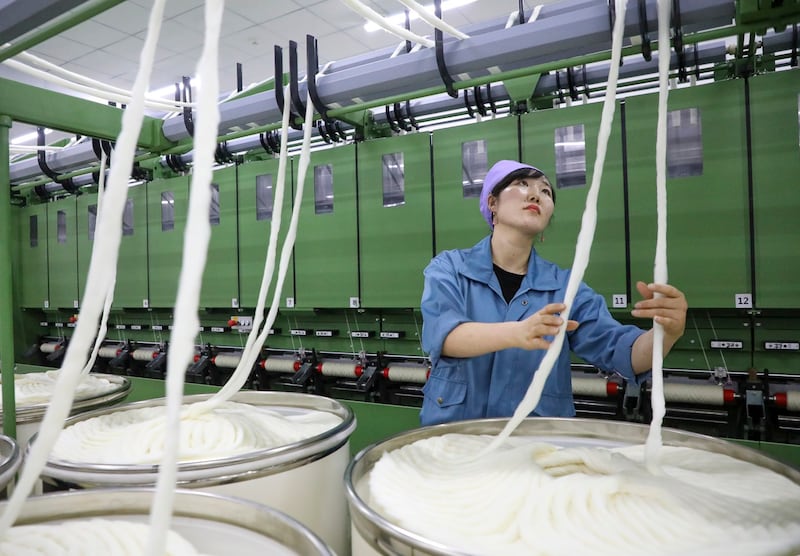 An employee works at the textile workshop of a cashmere processing enterprise, Sept. 24, 2024 in Lingwu, Ningxia Hui Autonomous Region, China. (Yu Jing/China News Service/VCG via Getty Images)