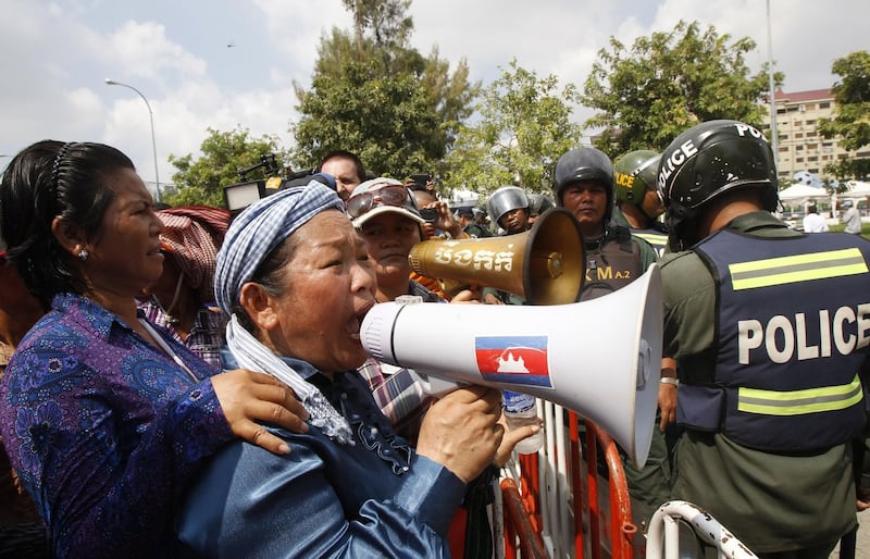 Cambodian protesters near the Australian Embassy in Phnom Penh, Cambodia, in a Sept. 26, 2014, file photo. Credit: AP