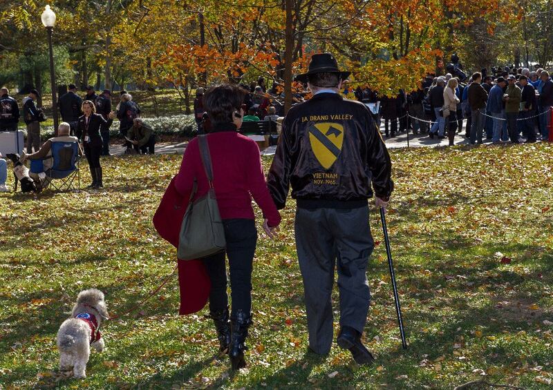 War author and correspondent Joseph Galloway(R)walks with his wife Dr. Gracie Liem Szuan Tzu after paying his respects at the Vietnam Memorial wall, in file photo.