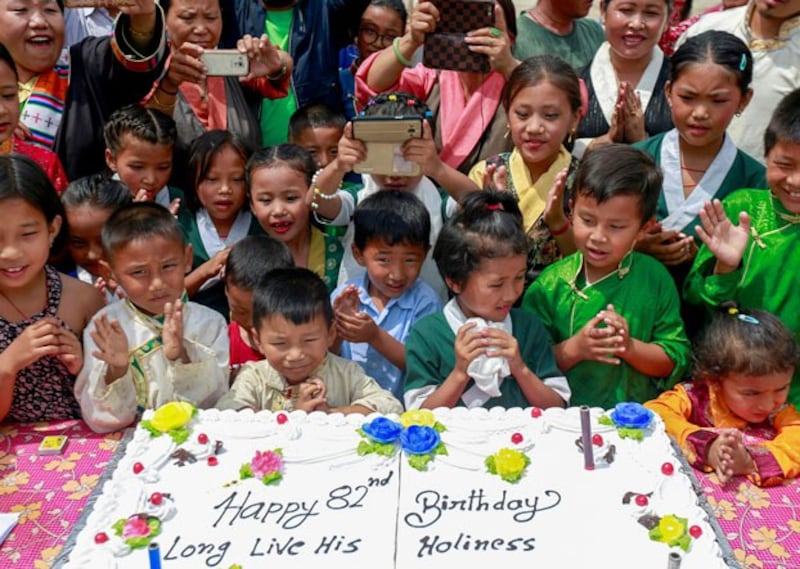 Tibetan children gather around a cake during an event marking the 82nd birthday celebration of Dalai Lama in Lalitpur, Nepal, July 6, 2017. (Navesh Chitrakar/Reuters)