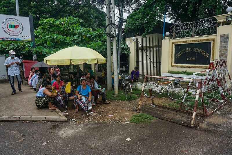 Family members wait in front of Yangon's Insein Prison as rumors emerged that those arrested by the junta would be released, June 26, 2021. RFA