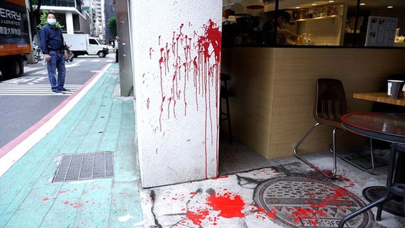 Scene where bookseller Lam Wing-kei was splashed with red paint at a coffee shop close to the crowd-funded bookstore he plans to open in Taipei this week, April 21, 2020.