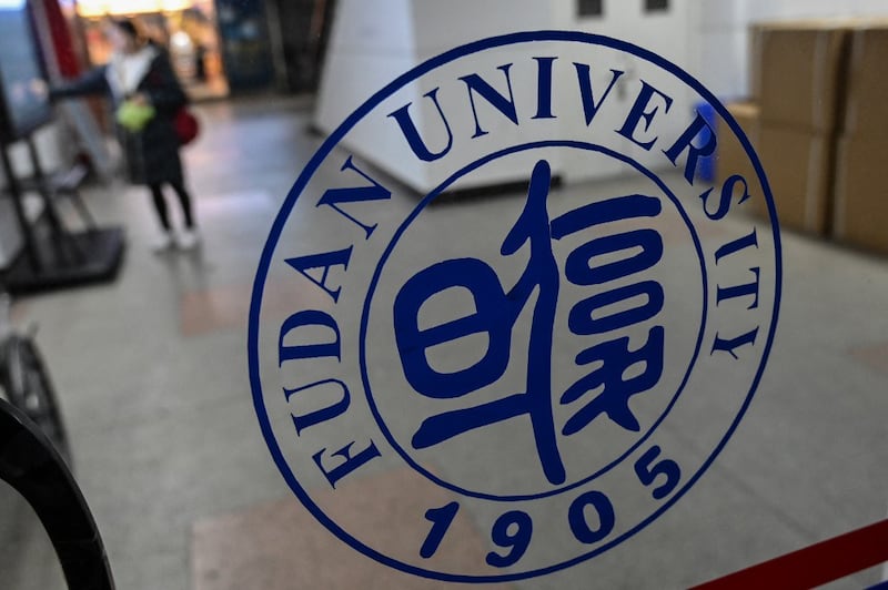 A December 2019 file photo showing a sign of Fudan University , One of China's top universities, on the campus in Shanghai. Credit: AFP.