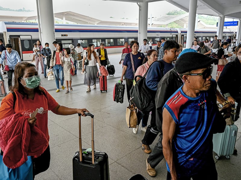 Passengers after disembarking from a high-speed train at the railway station in Luang Prabang province,, Laos, Oct. 12, 2024.