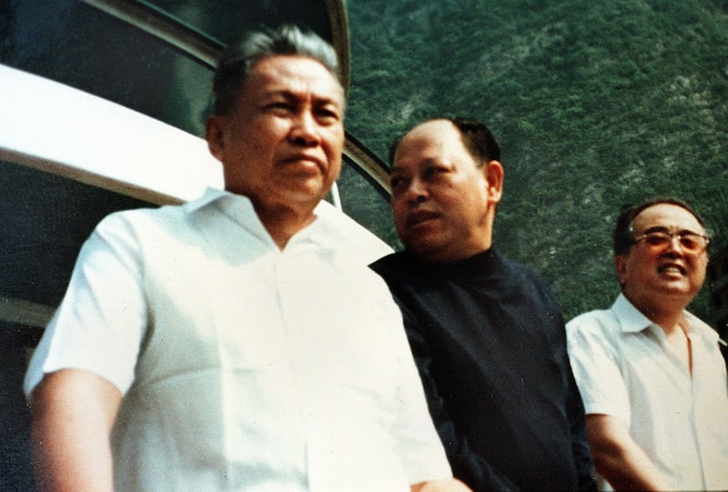 An undated photo of Cambodian dictator Pol Pot [left] with former Khmer Rouge foreign minister Ieng Sary [center] was found in the guerilla leader's former stronghold of Anlong Veng by an Agence France-Presse reporter on March 28, 1998. The picture was believed to be taken in China in the late 1970's, according to Pich Chheang, former Khmer Rouge ambassador to China. Credit: AFP