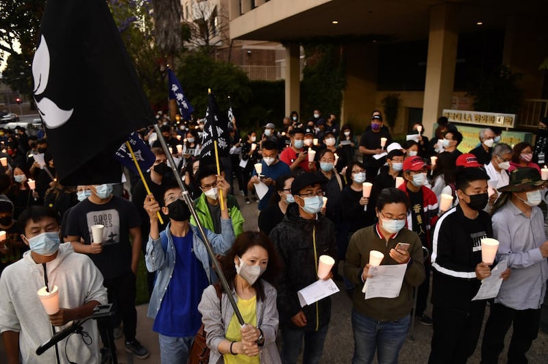 People attend a vigil commemorating the 32nd anniversary of the 1989 Tiananmen square pro-democracy protests and crackdown outside of the Chinese consulate in Los Angeles, California, June 4, 2021.