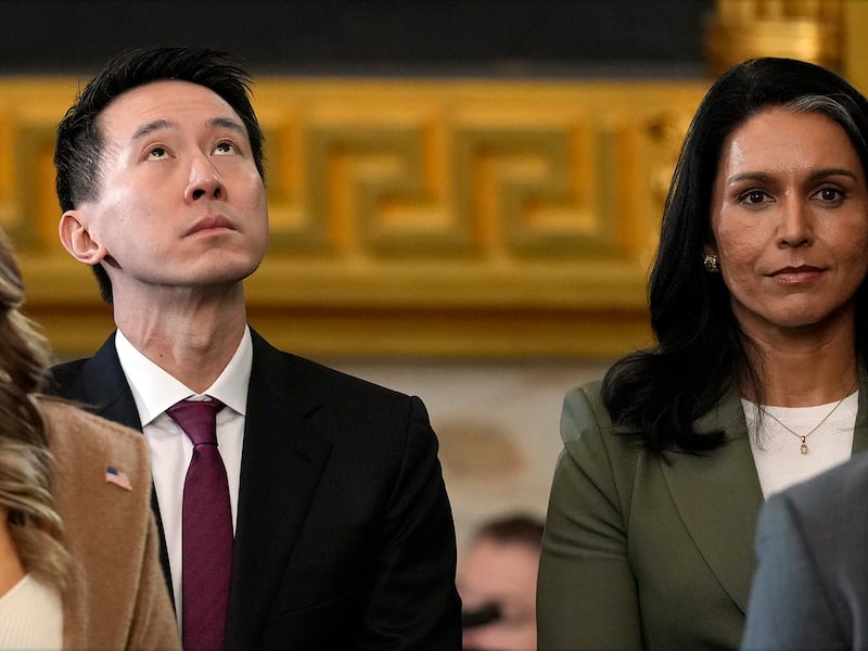 TikTok CEO Shou Chew, left, stands with Tulsi Gabbard, right, the nominee to be the next director of national intelligence, at the Capitol in Washington, Jan. 20, 2025.