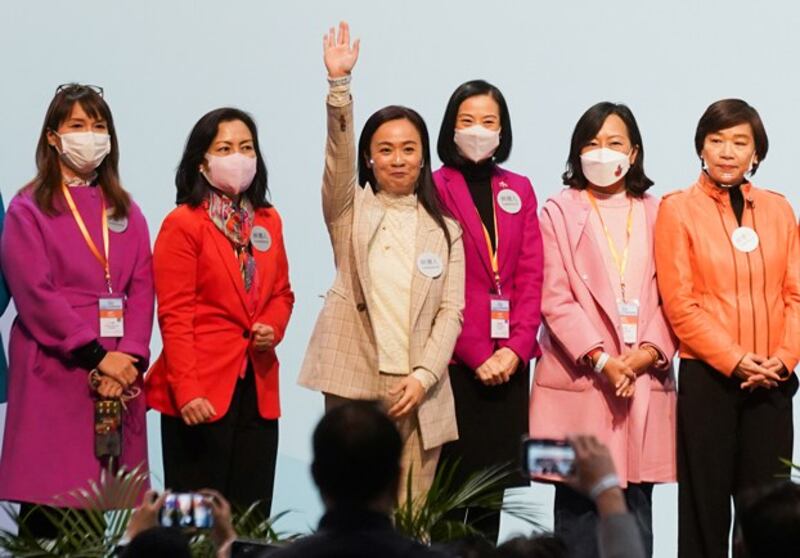 Candidates celebrate after winning in the Legislative Council election in Hong Kong, December Dec. 20, 2021. The rules for the election were changed to ensure only 'patriots' loyal to Beijing could stand as candidates or hold any kind of public office. Credit: Lam Yik/Reuters