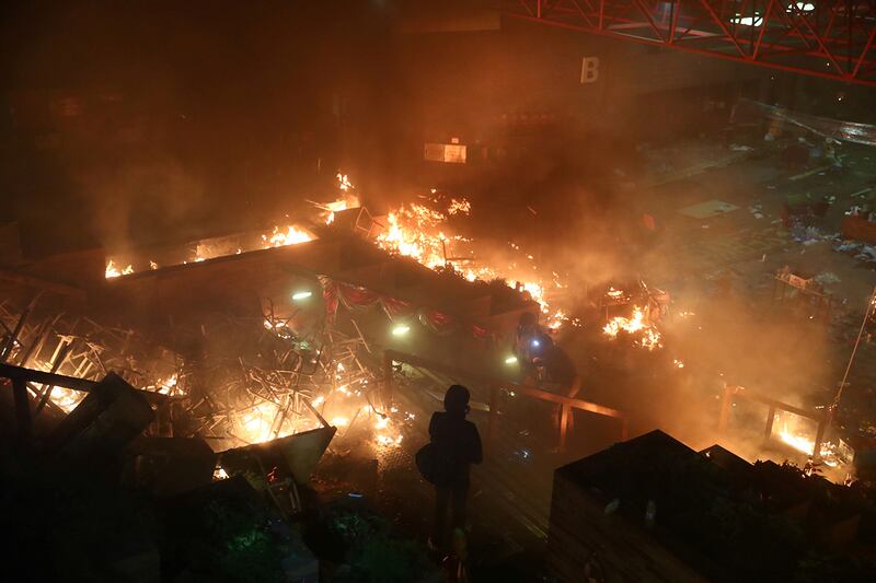 A fire burns at Hong Kong Polytechnic University during an anti-government protest in Hong Kong, Nov. 18, 2019.