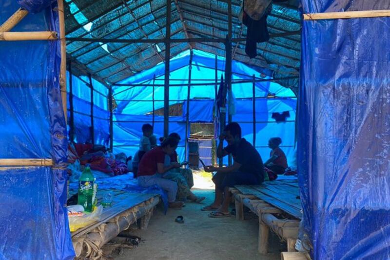 Refugees who fled Myanmar rest in a shelter at Farkawn quarantine camp in India's eastern state of Mizoram near the Myanmar border, Sept. 23, 2021. Credit: AFP