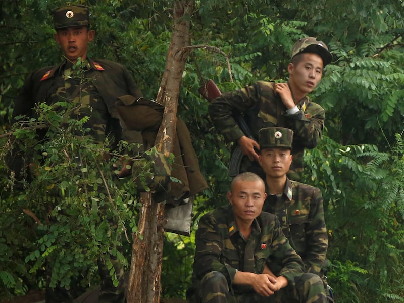 North Korean soldiers on the bank of the Yalu River, near the North Korean town of Sinuiju, Sept. 10, 2016.