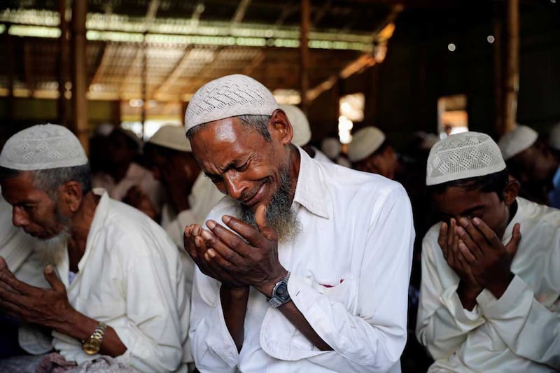 A Rohingya refugee cries during Eid al-Adha prayer in Kutupalong refugee camp in Cox's Bazar, Bangladesh, August 22, 2018. REUTERS/Mohammad Ponir Hossain