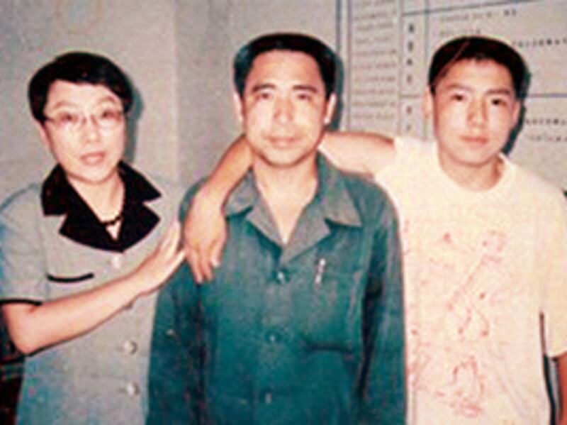 Mongolian dissident Hada, center, his wife and fellow activist Xinna, left,  and son Uiles, undated photo.